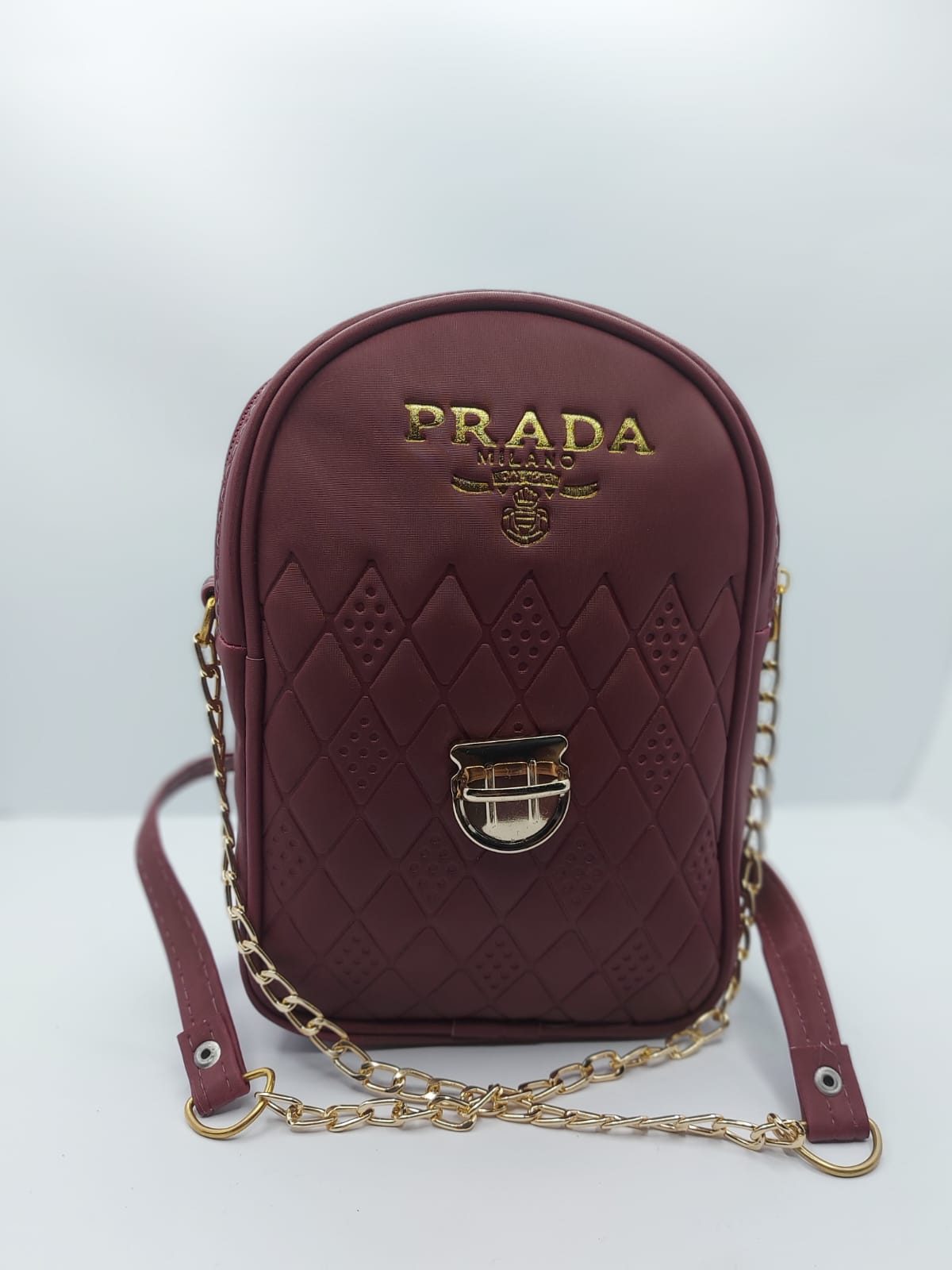 Stylish Elegant Maroon Mini Crossbody Bag with quilted diamond pattern and gold-toned chain strap for a sophisticated look.