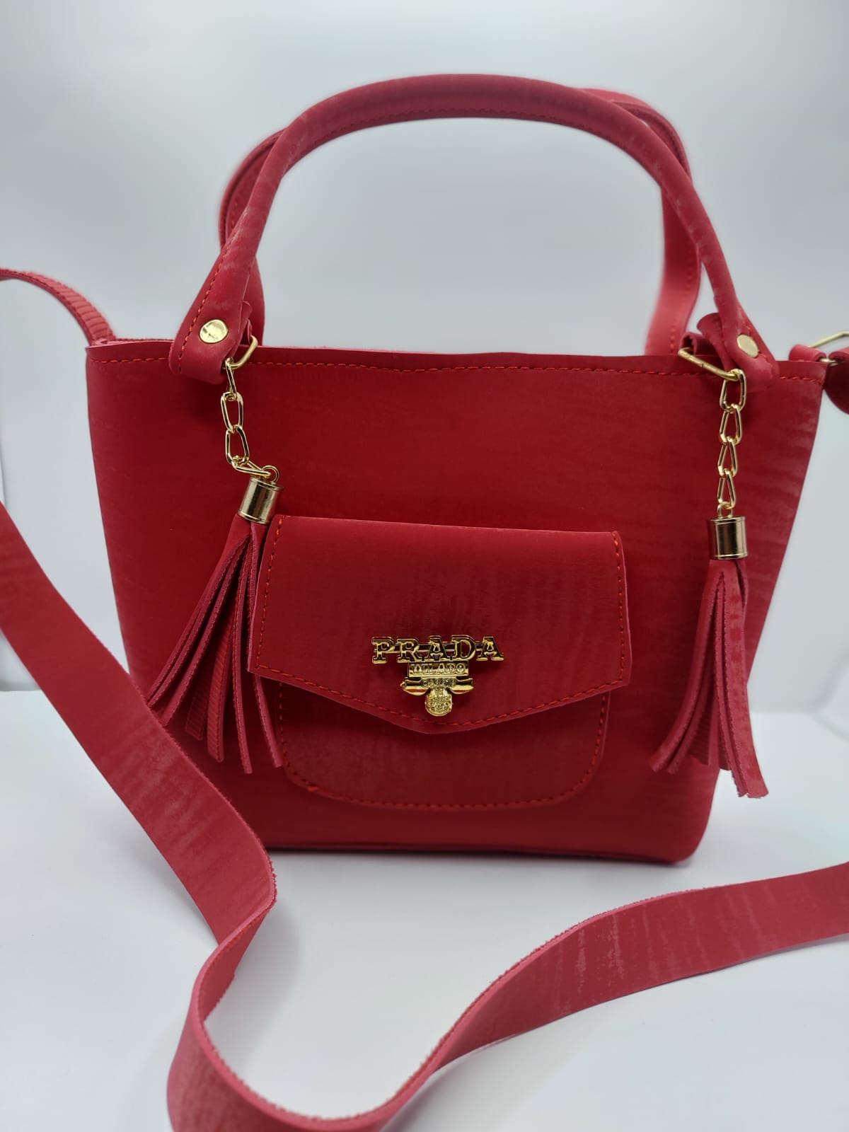 The Red Velvet Charm Tote Bag blends luxury and practicality with its plush velvet texture, gold-tone chain accents, and versatile carrying options for any occasion