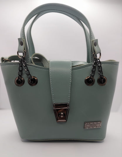 Mint Green tote bag with metallic twisted lock, crafted from premium PU leather. Features hand tote and adjustable shoulder straps, dual zippers for storage, and a sleek solid design with metallic details. Ideal for daily use or special occasions
