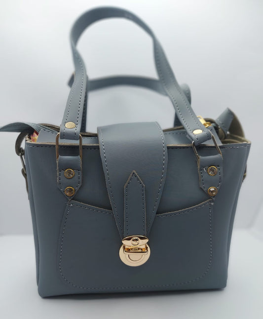 Stylish slate gray tote bag with a gold-tone lock, front pocket, and dual carrying options. Made of high-quality synthetic leather with neat stitching