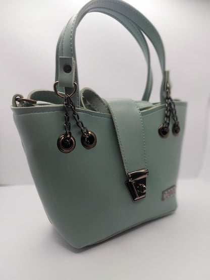 Mint Green tote bag with metallic twisted lock, crafted from premium PU leather. Features hand tote and adjustable shoulder straps, dual zippers fot storage, and a sleek solid design with metallic details. Ideal for daily use or special occasions
